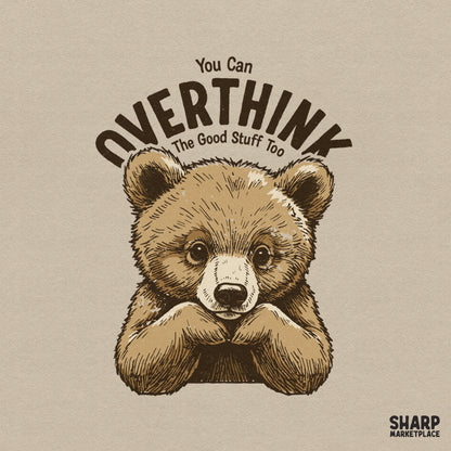 Cute hand-drawn brown bear cub resting chin on paws with arched vintage text You Can Overthink The Good Stuff Too for apparel and sublimation.