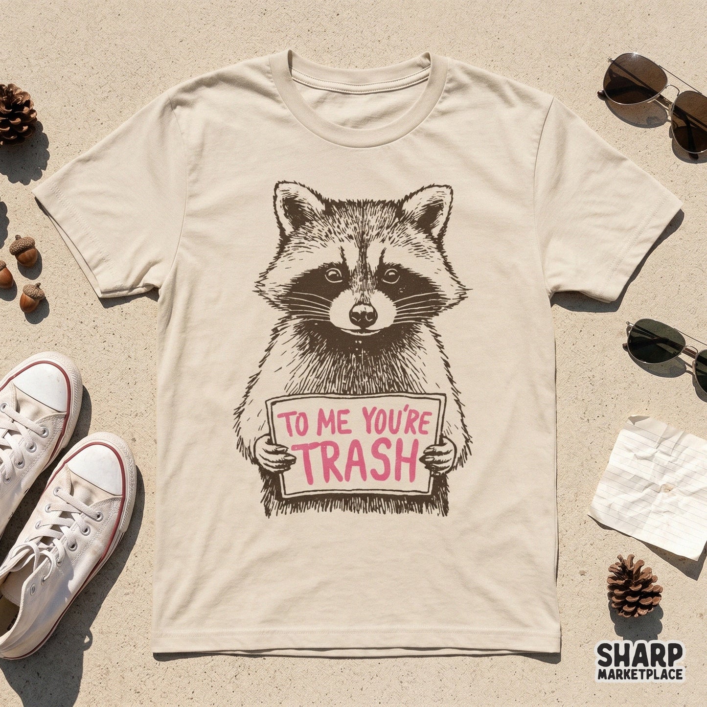 Detailed line-art raccoon holding a sign with witty text, designed as a transparent PNG for versatile use on tumblers, stickers, and apparel printables.