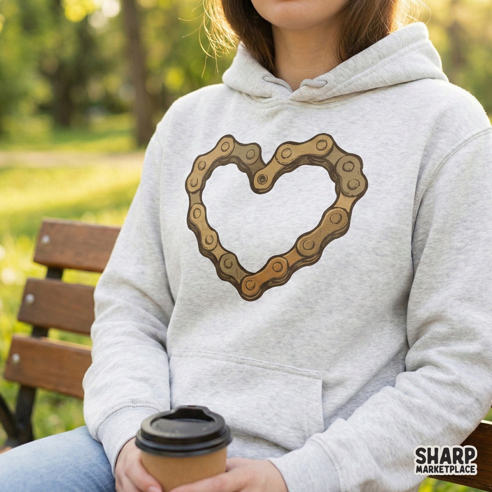 Detailed golden-brown bicycle chain heart graphic isolated on a neutral background, ideal for sublimation, stickers, and bike lover gifts.