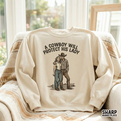 Cream-colored sweatshirt mockup displaying a vintage-inspired western illustration of a couple with the quote A Cowboy Will Protect His Lady.