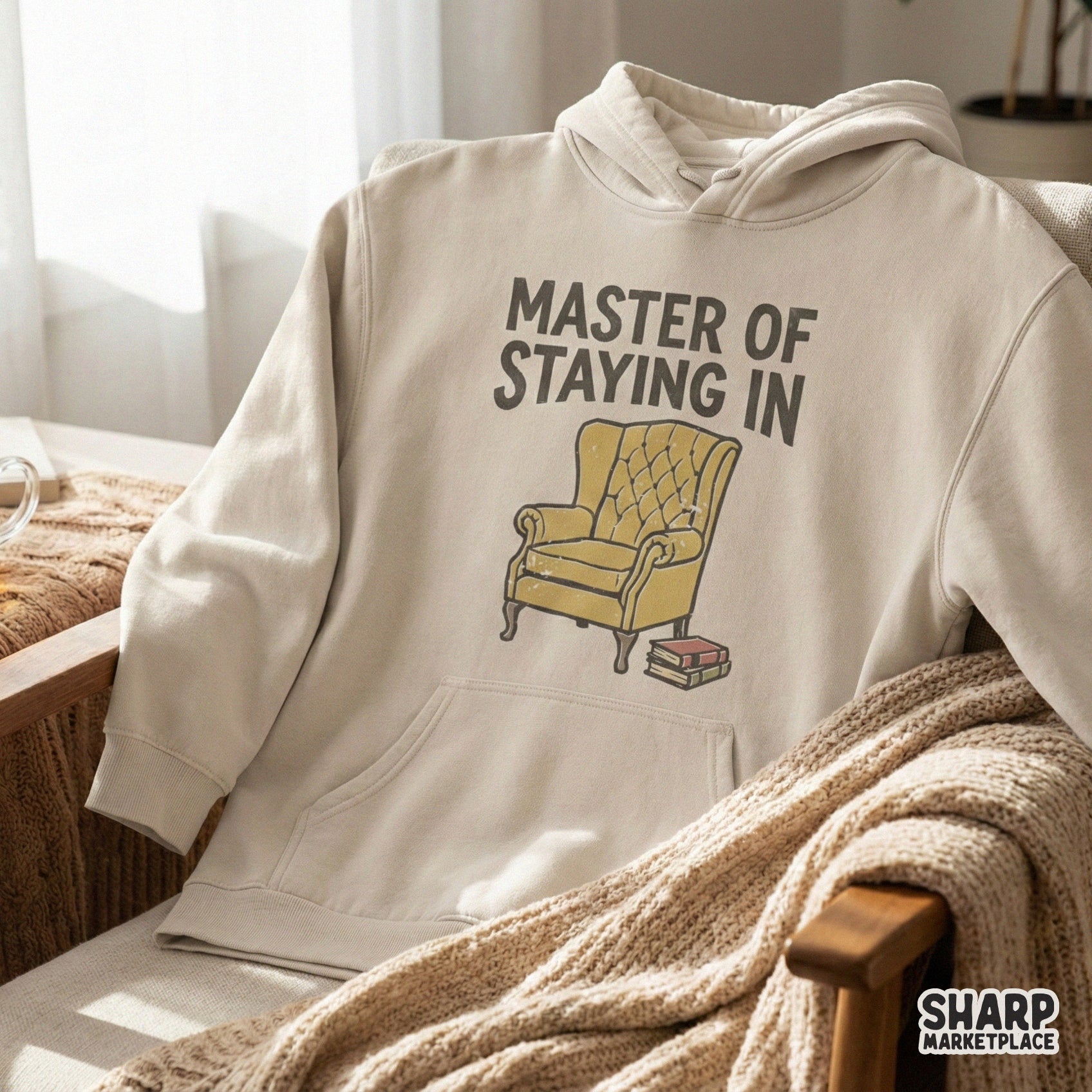 Vintage style illustration of a reading chair and books with the quote Master Of Staying In, designed for high-quality sublimation and apparel printing.