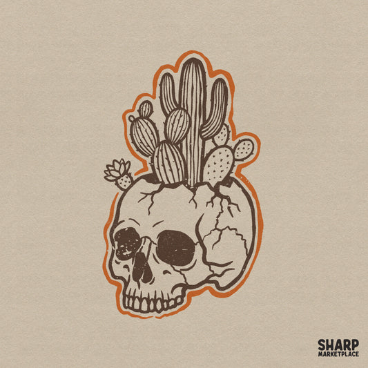 Vintage brown ink skull planter with various desert cacti and a blooming succulent, featuring a bold orange die-cut outline for western apparel.