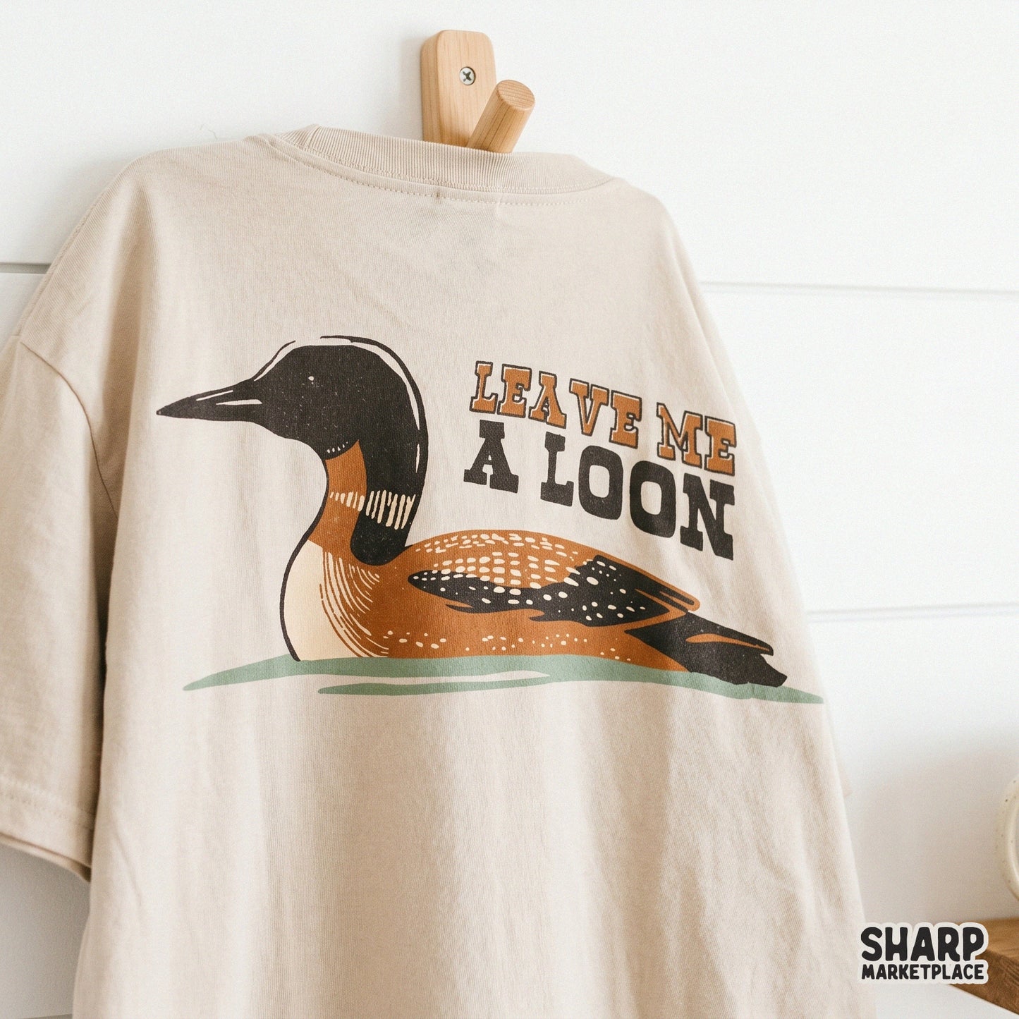 Funny sarcastic introvert bird design with a leave me a loon saying for shirt sublimations