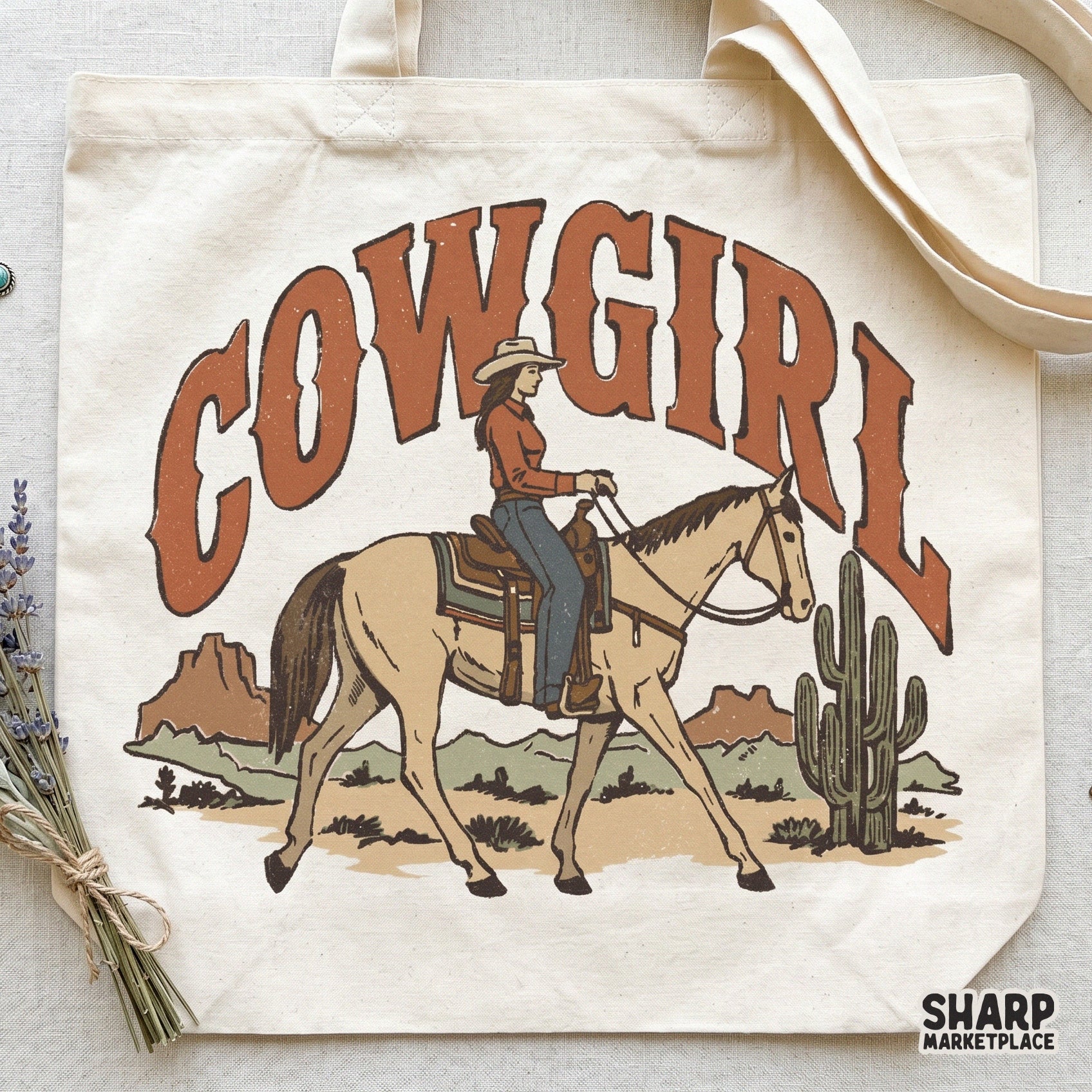 Digital western graphic for apparel featuring a cowgirl riding a horse, desert scenery, and rustic burnt-orange lettering for sublimation projects.