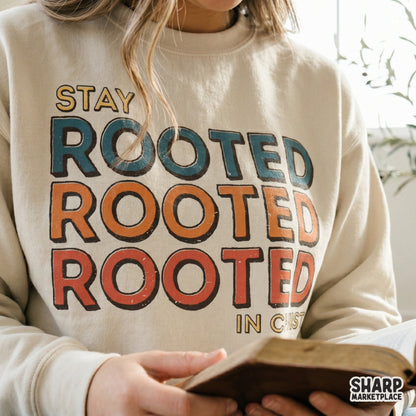 Inspirational scripture design with the words Stay Rooted Rooted Rooted In Christ, perfect for custom t-shirts, stickers, and religious wall art.