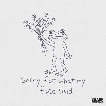 Hand-drawn line art of a grumpy frog holding a bouquet of flowers with the text Sorry for what my face said, perfect for funny apparel designs.