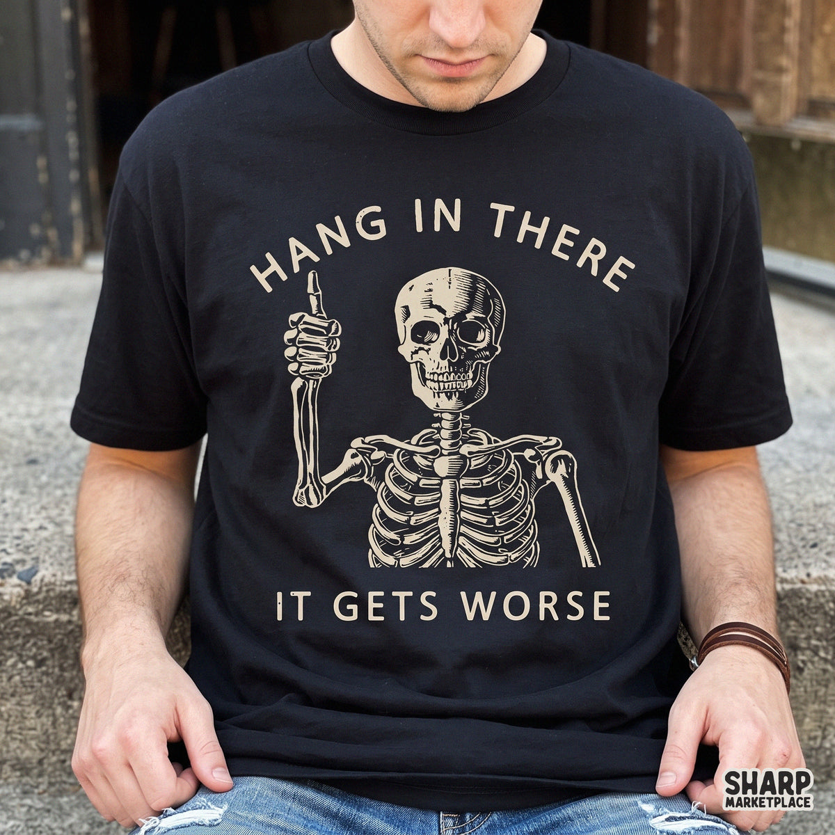 Sarcastic skeleton giving a thumbs up with Hang In There It Gets Worse text for retro shirt designs