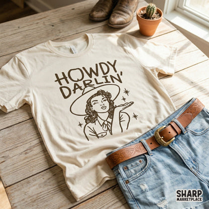 Brown line art design of a winking cowgirl in a wide-brimmed hat blowing a kiss with sparkles, perfect for trendy western t-shirt printing.