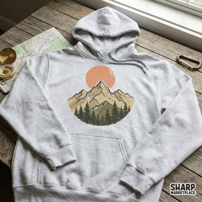 Nature-inspired mountain adventure graphic with a muted sunset and pine forest, suitable for custom t-shirt printing, tumblers, and outdoor themed crafts.