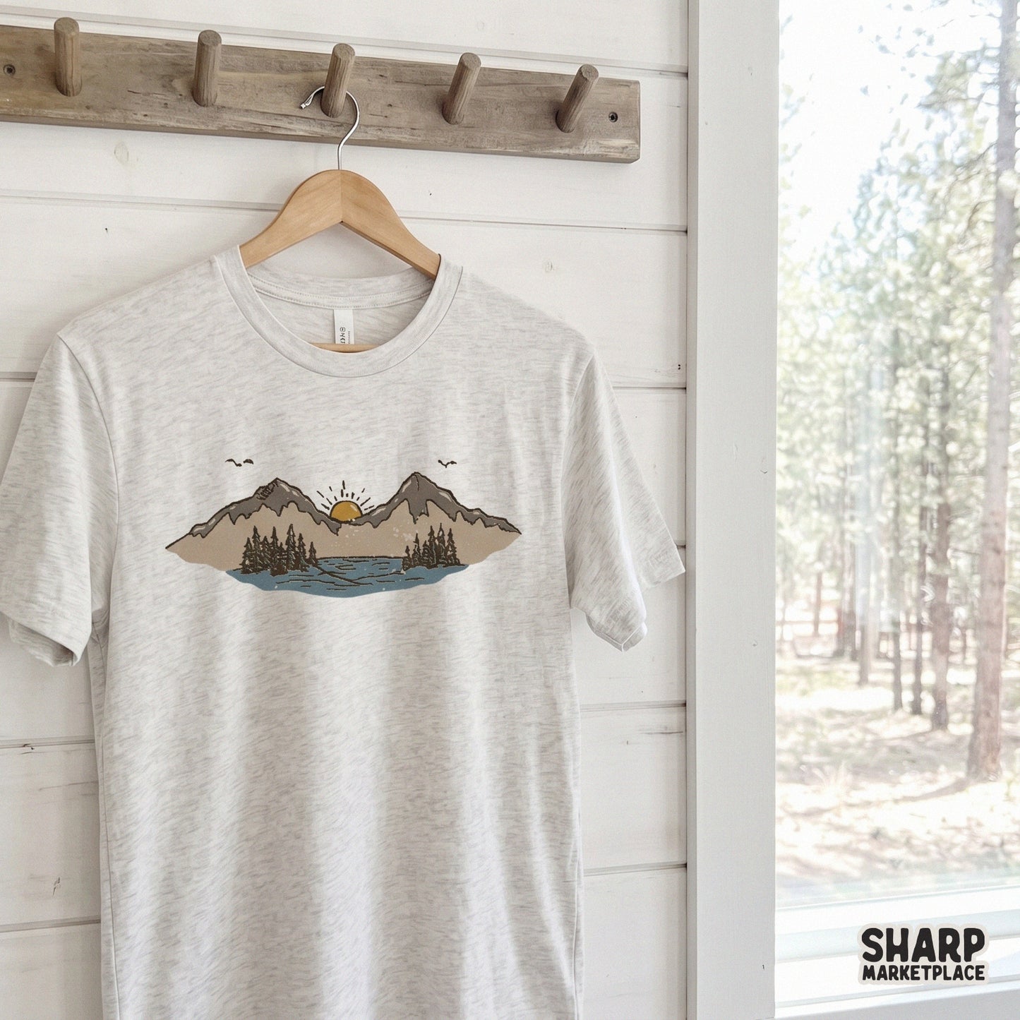 Distressed mountain lake sunset graphic with pine trees and a golden sun, perfect for outdoorsy nature-themed t-shirts and DIY hiking apparel.
