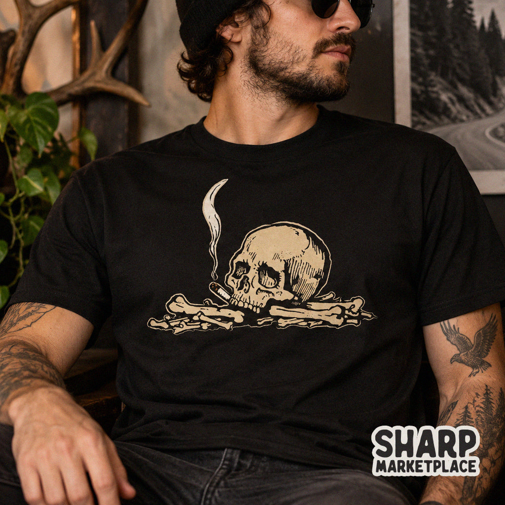 Edgy vintage skull smoking a cigarette on a pile of bones gothic art PNG design for Halloween t-shirts and apparel