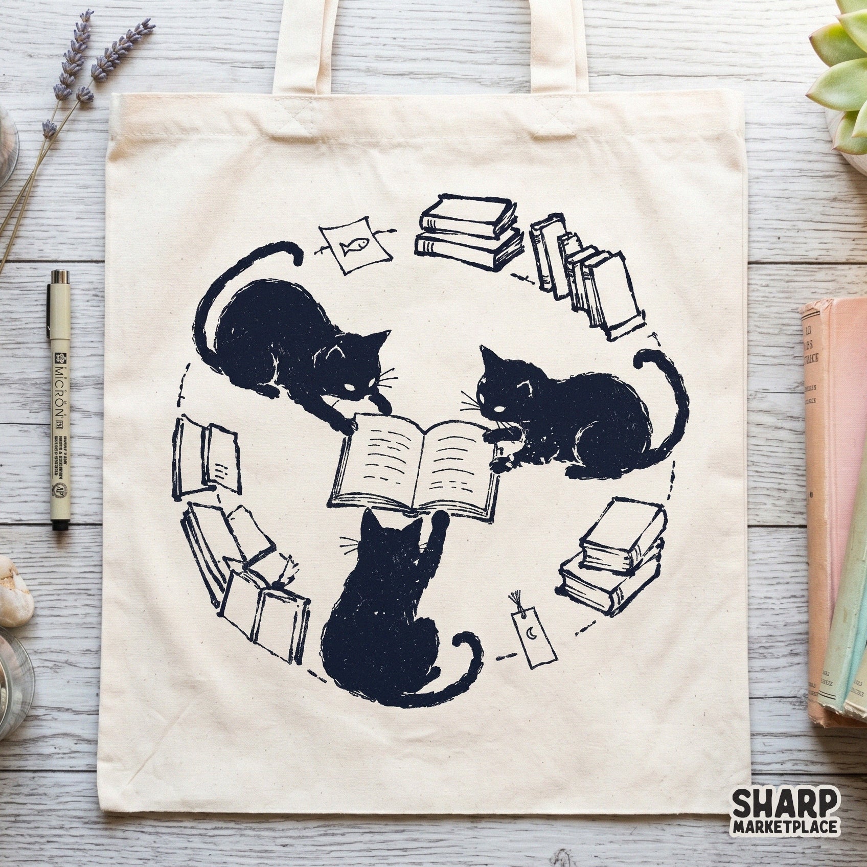 Hand-drawn illustration of three black kittens gathered around an open book, featuring a crescent moon charm and books, perfect for sublimation prints.