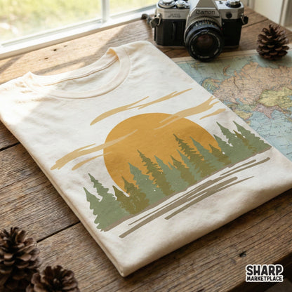Vintage landscape design printed on a t-shirt showing a golden sun and forest silhouette, perfect for nature-inspired sublimation and DIY projects.