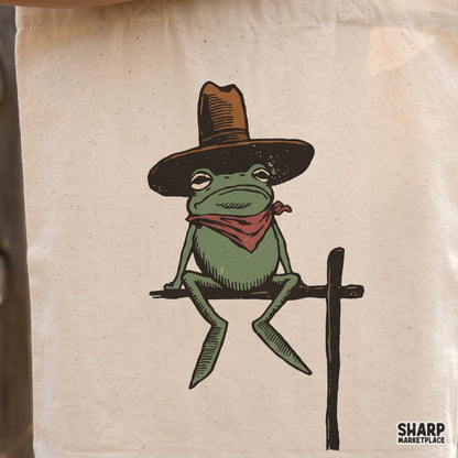 Funny rodeo frog in a cowboy hat and red bandana retro western PNG design for t-shirts and apparel