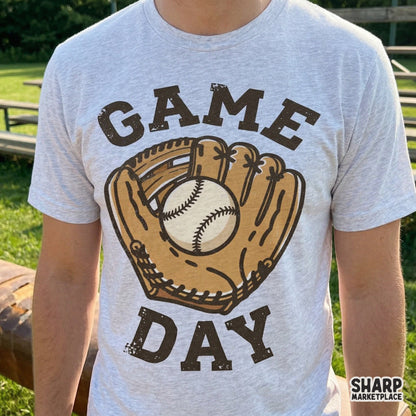 Distressed Game Day baseball graphic printed on a heather gray t-shirt, showcasing a vintage glove and ball illustration for custom sports clothing.