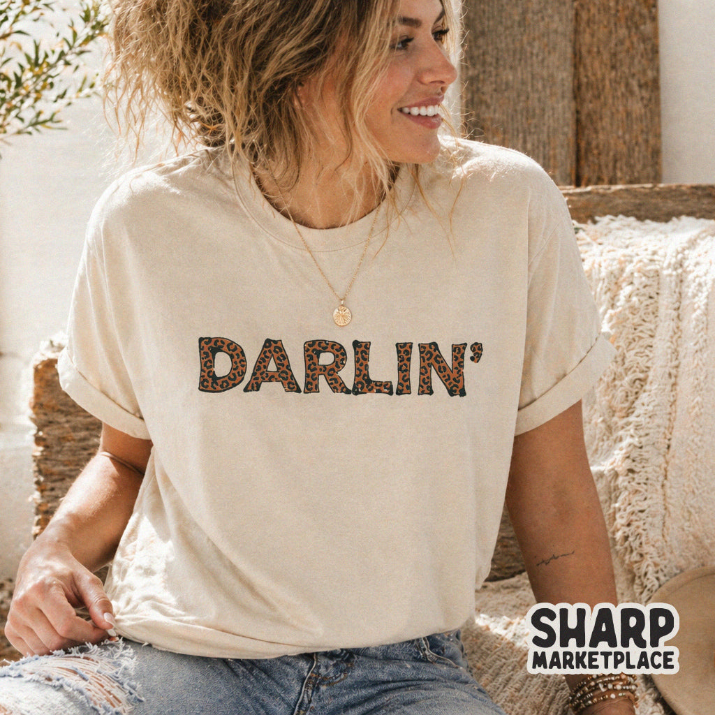 Retro cowgirl style Darlin text featuring a trendy leopard print fill, perfect for custom t-shirt designs and western inspired crafts.