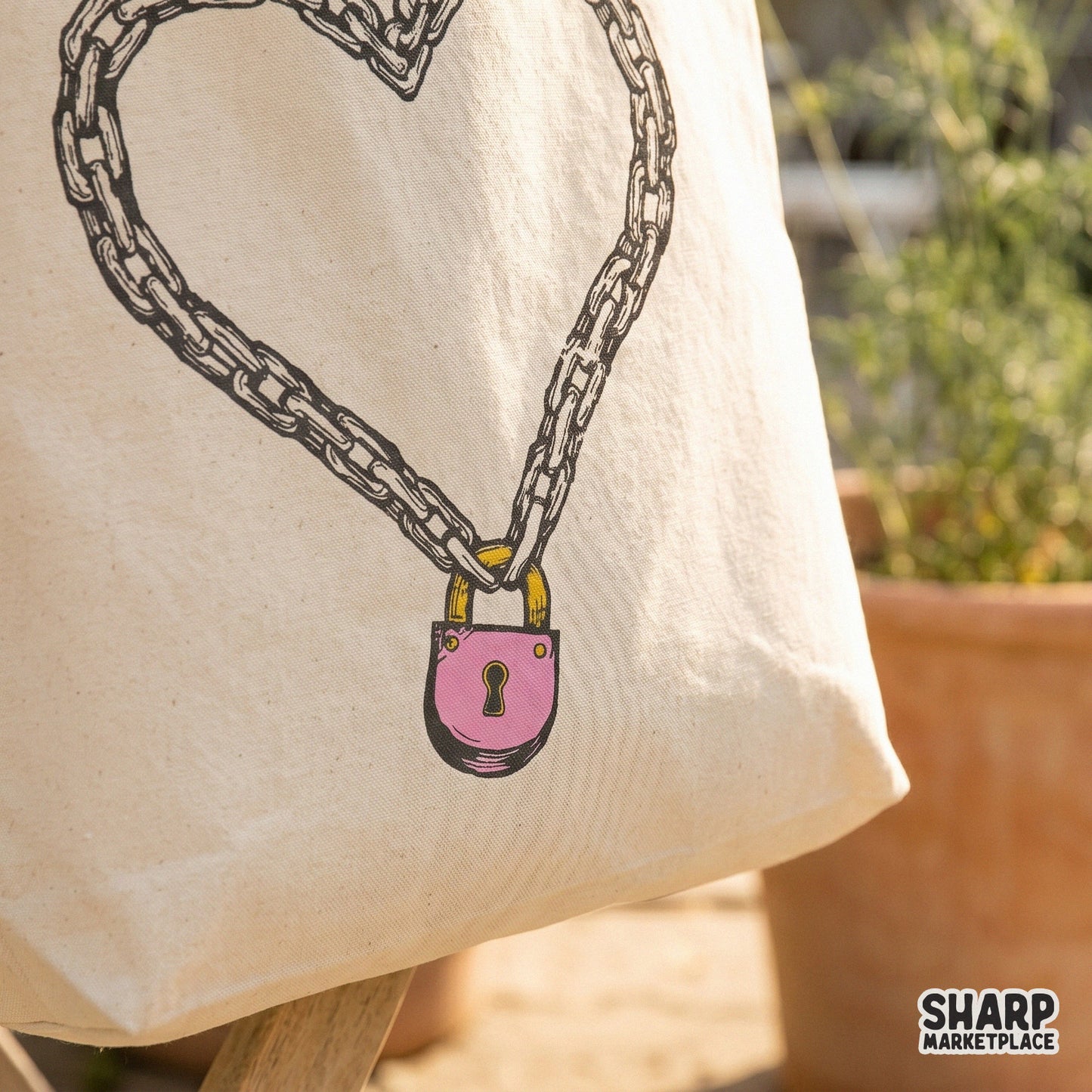 Romantic yet gritty chain heart art with a pink lock, a versatile digital design for Valentine apparel, tumblers, and wall art.