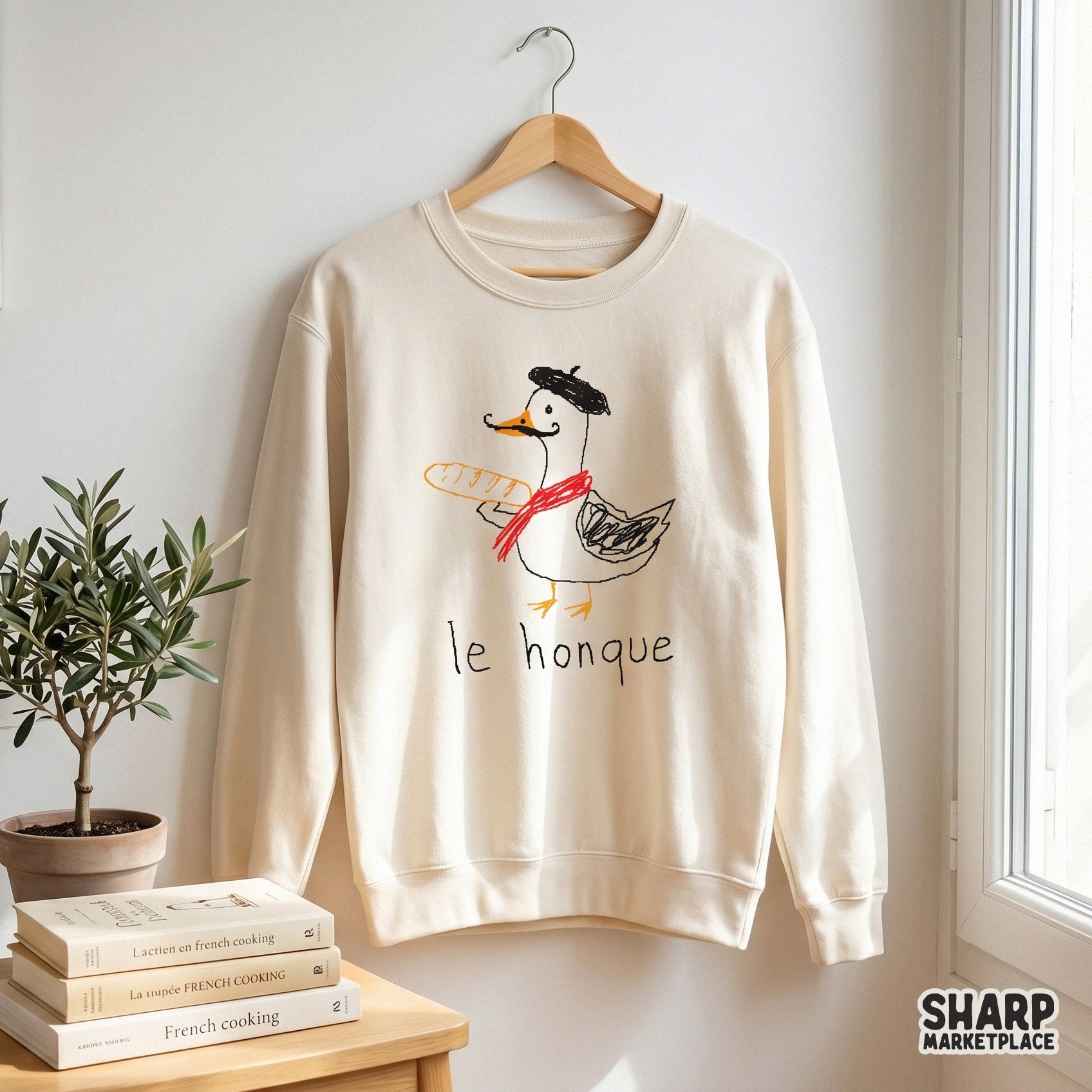 Playful crayon-style sketch of a French-themed goose with a mustache and baguette, a funny animal meme design for print-on-demand mugs and wall art.