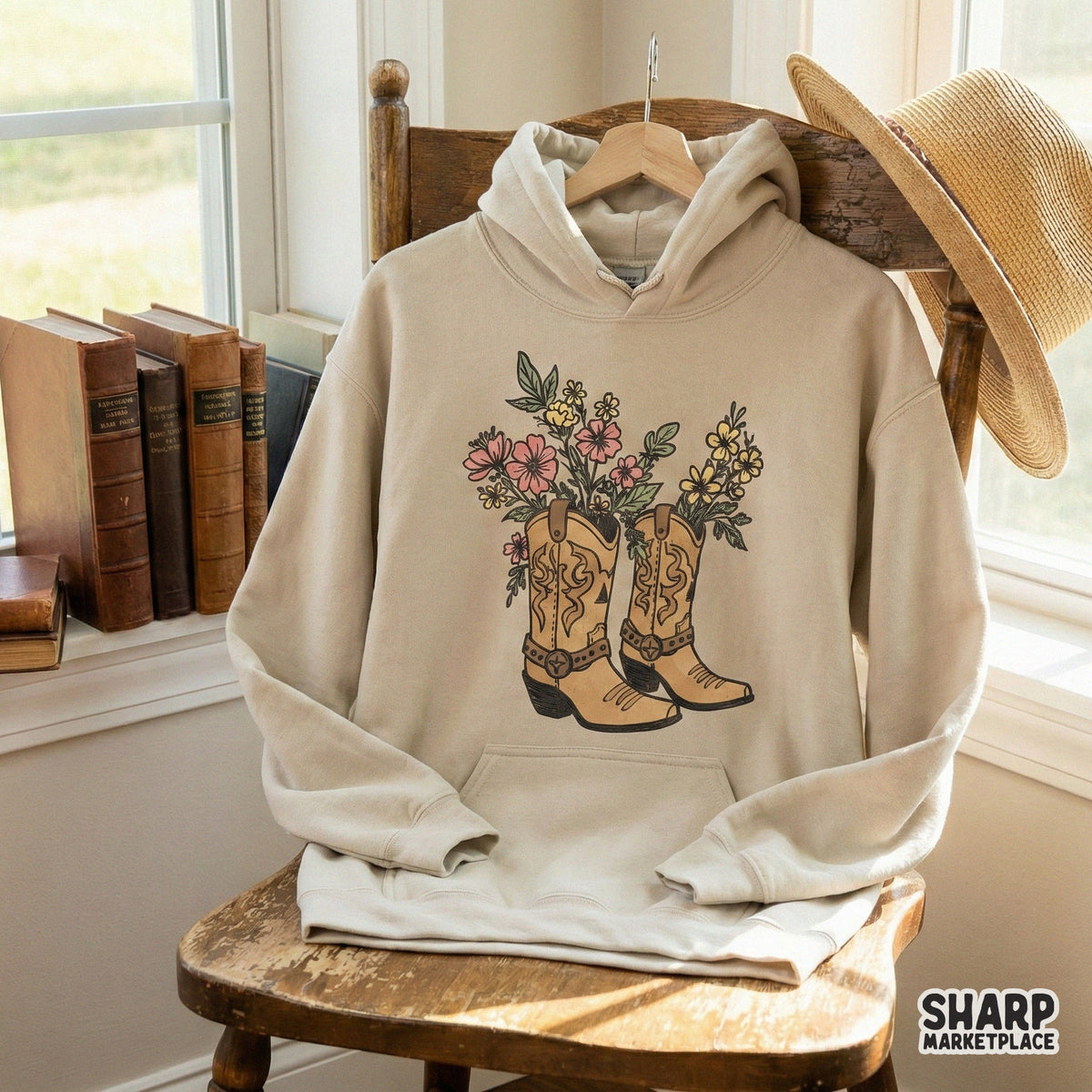 Digital western graphic of rustic cowboy boots overflowing with wildflowers in muted tones, perfect for custom tumblers, stickers, and country-themed decor.