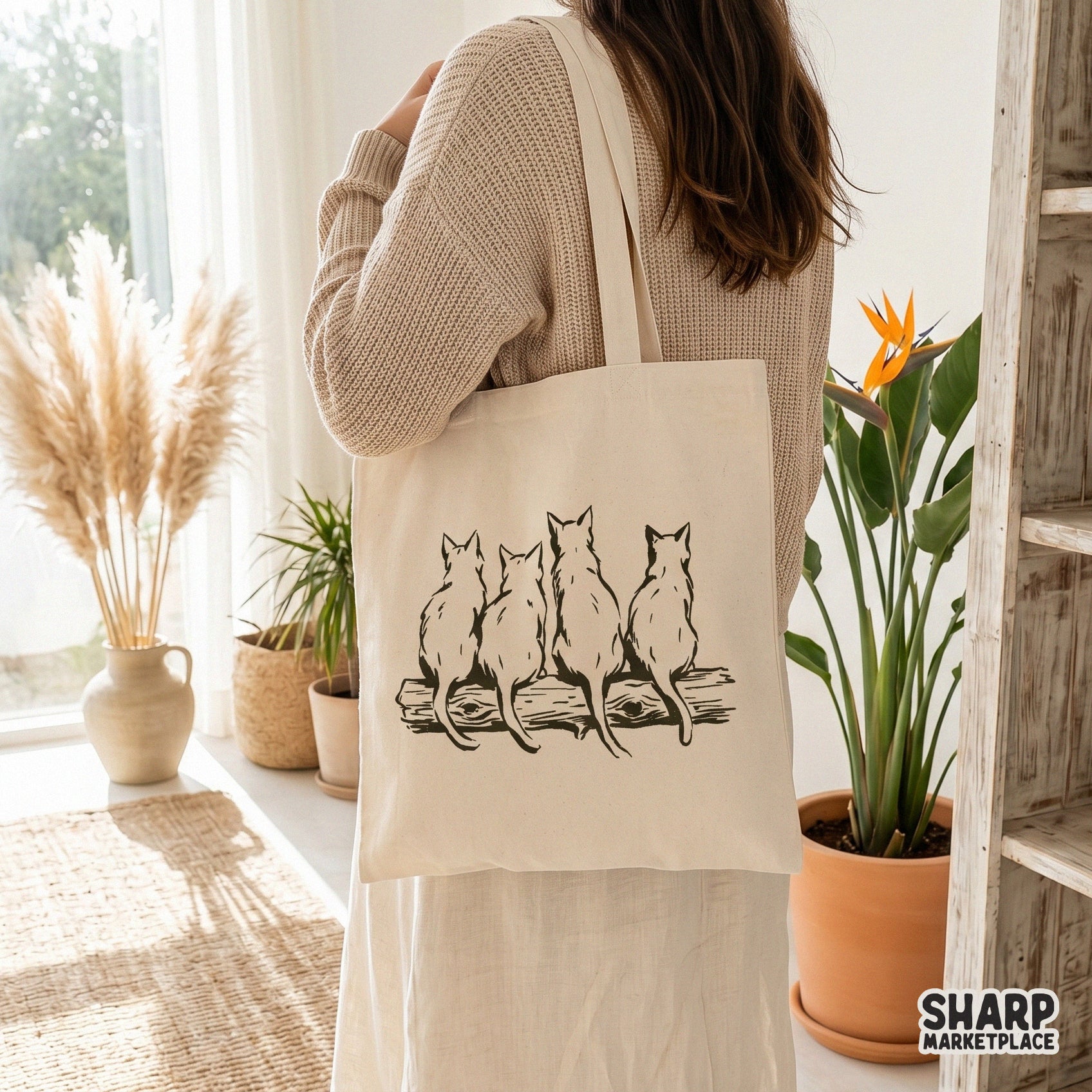 Vintage hand drawn vintage feline family featuring four cats sitting on a log for a retro cute mom shirt design