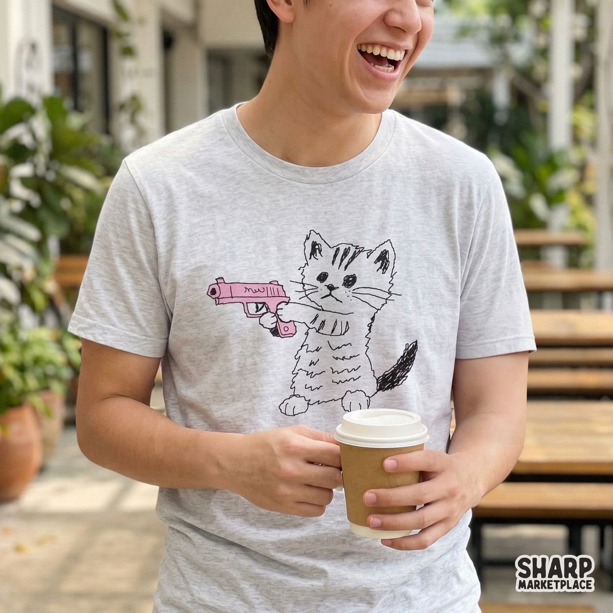 Sarcastic kitten sketch design featuring a monochromatic cat with a bright pink toy blaster, perfect for custom t-shirt printing and digital art.