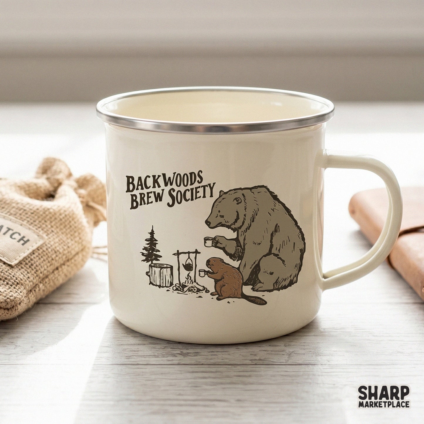 Etched style woodland graphic showing a bear and beaver at a campfire with the words Backwoods Brew Society, ideal for DIY tumblers or shirts.