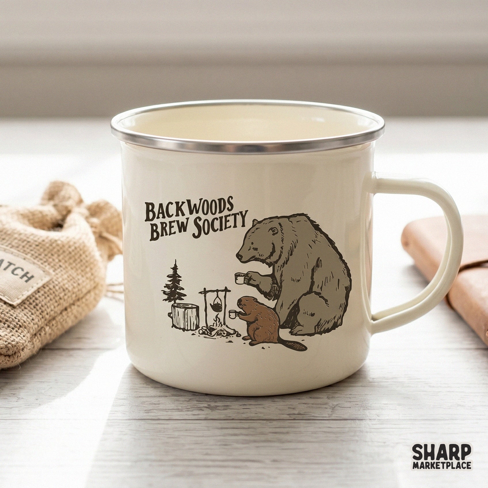 Etched style woodland graphic showing a bear and beaver at a campfire with the words Backwoods Brew Society, ideal for DIY tumblers or shirts.