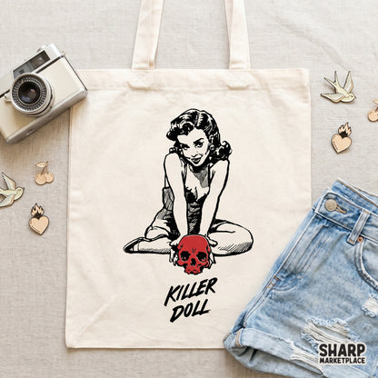 Hand-drawn pinup girl holding a crimson skull with grunge lettering for macabre apparel designs and dark humor sublimation transfers