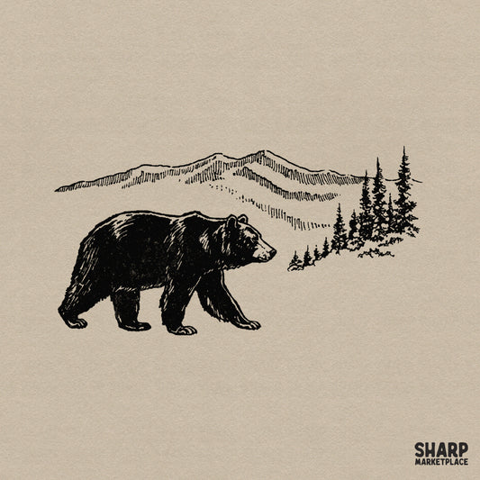 Vintage black ink illustration of a walking bear in front of a mountain range and pine forest for rustic camping shirt designs and nature projects