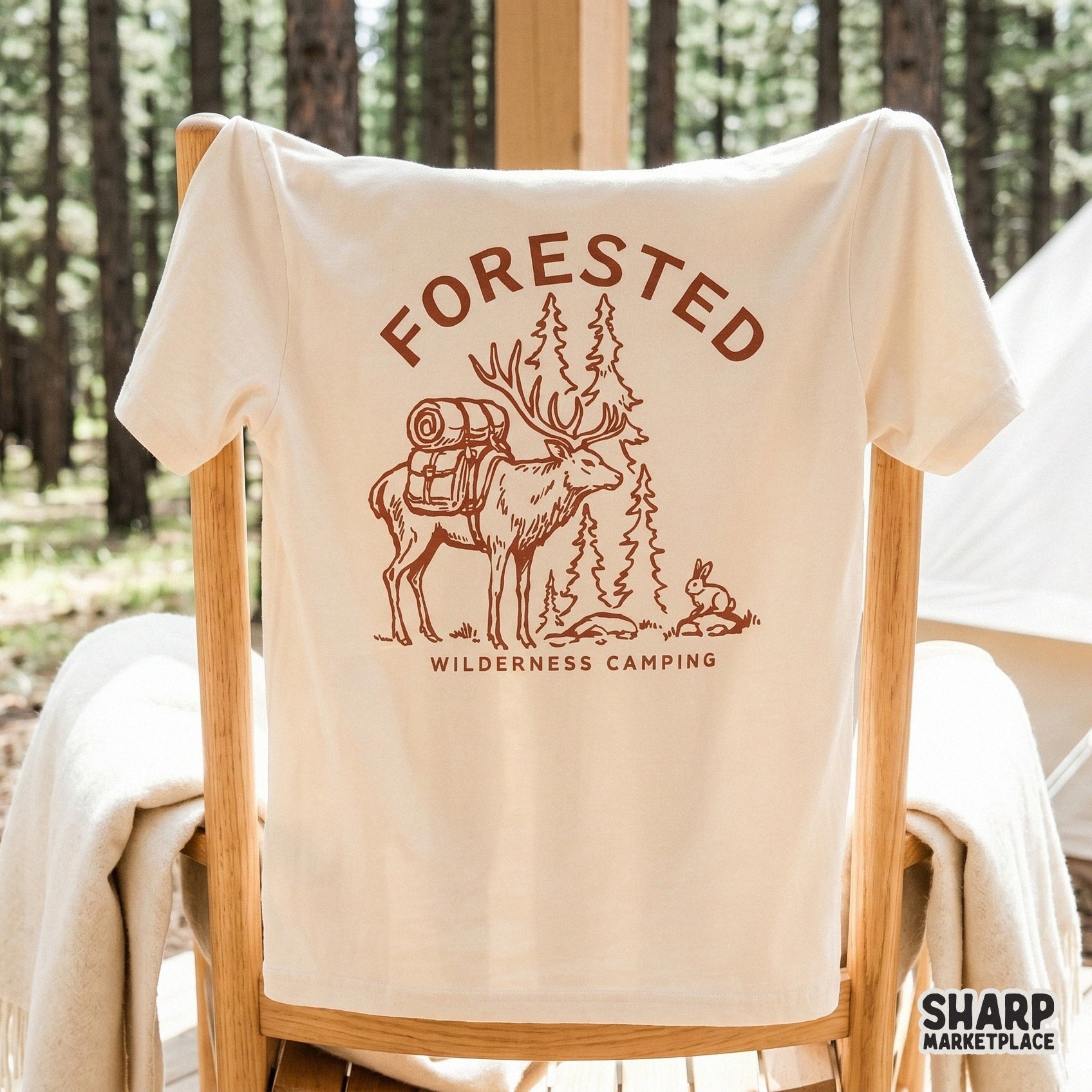 Detailed hand-drawn elk and forest scene with rustic lettering, suitable for creating custom camping gear, tumblers, and rugged outdoor merchandise.