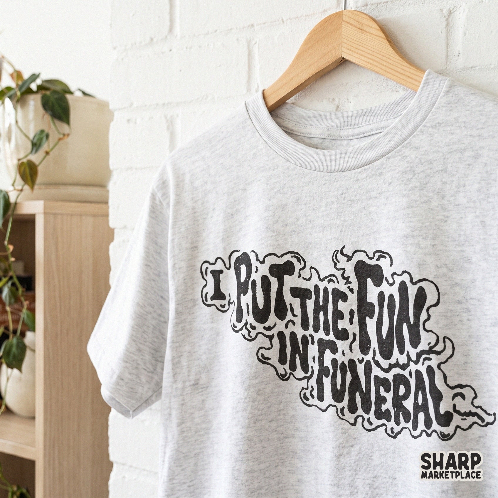 Funny dark humor wavy text design saying I Put The Fun In Funeral for sarcastic Halloween shirts and spooky sublimation projects