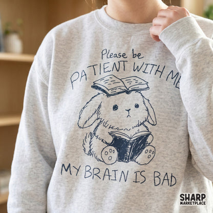 Digital download design featuring a whimsical bunny character in a sketch style with the text Please be patient with me my brain is bad, perfect for apparel or