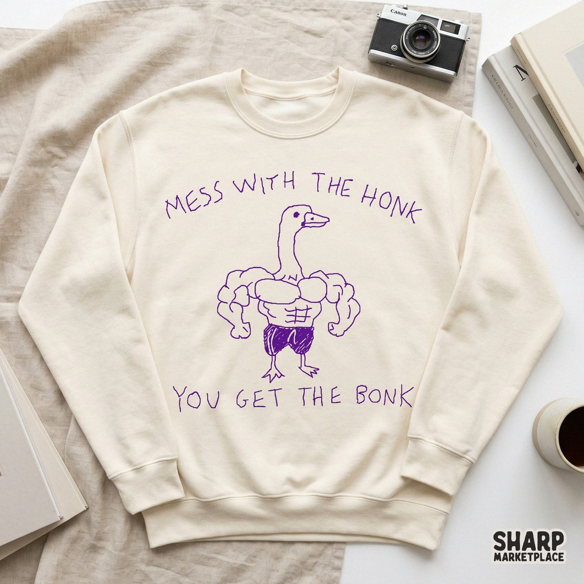 Digital design of a funny muscle bird in a purple hand-drawn style with the humorous phrase Mess With The Honk You Get The Bonk for stickers.
