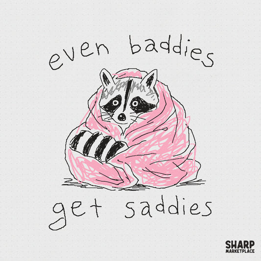 Hand-drawn sketch of a raccoon wrapped in a pink blanket with the text Even Baddies Get Saddies, perfect for sarcastic apparel and stickers.
