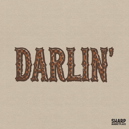 Darlin text design featuring rustic western slab-serif letters with a brown leopard print and checkerboard pattern for sublimation and apparel.