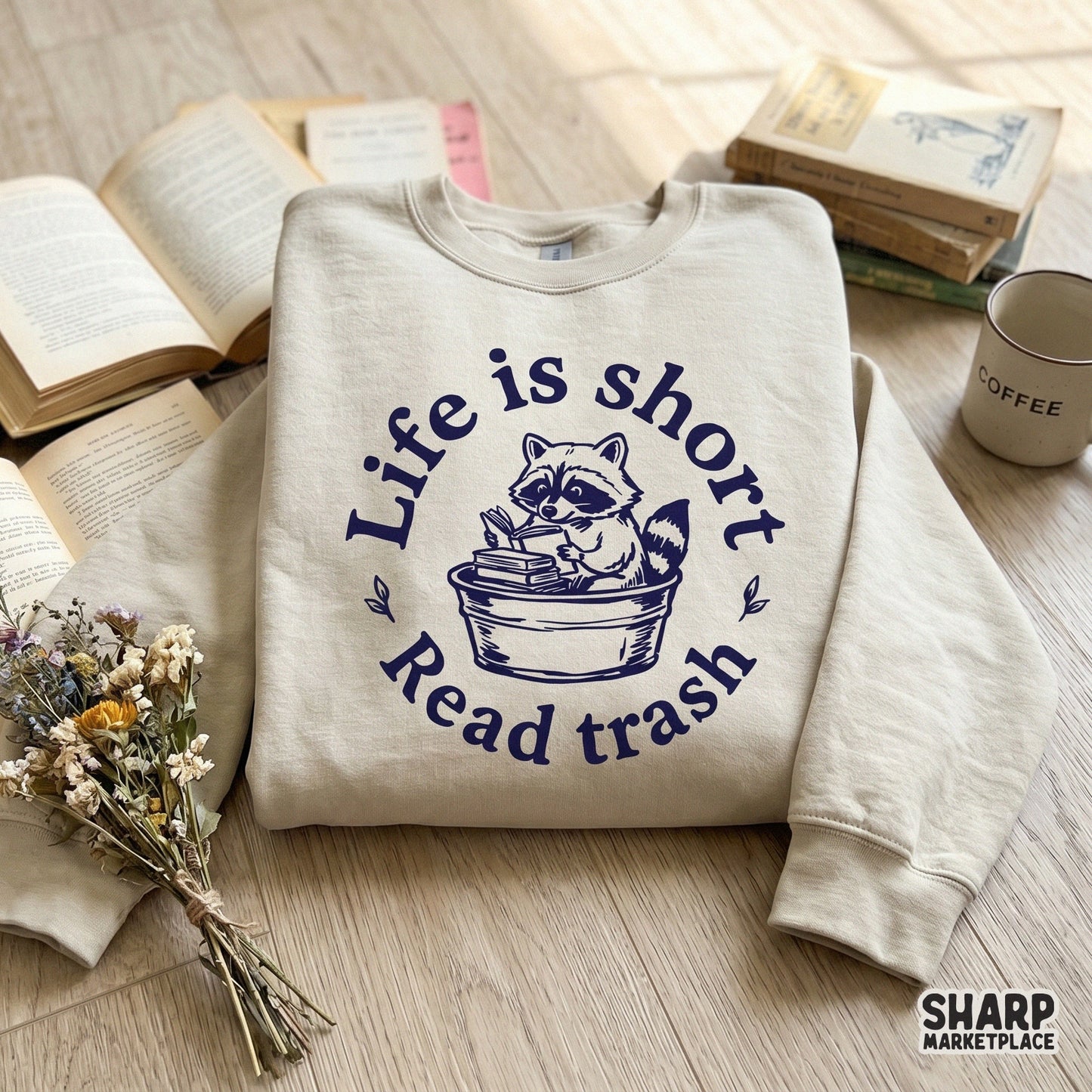Sarcastic trash panda reading design with a circular frame and leaf accents, ideal for DIY t-shirt printing, tote bags, or custom book club merchandise.