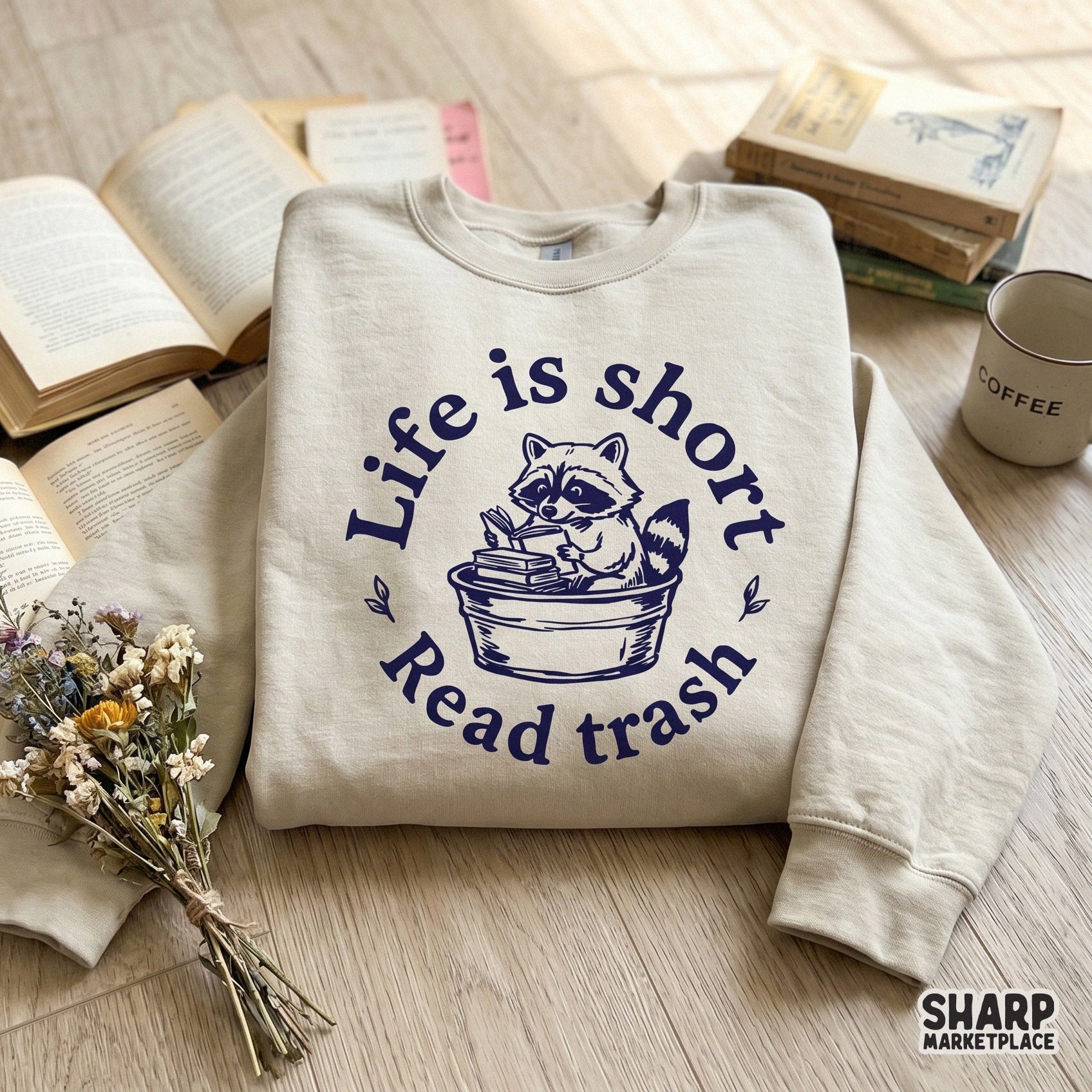 Sarcastic trash panda reading design with a circular frame and leaf accents, ideal for DIY t-shirt printing, tote bags, or custom book club merchandise.