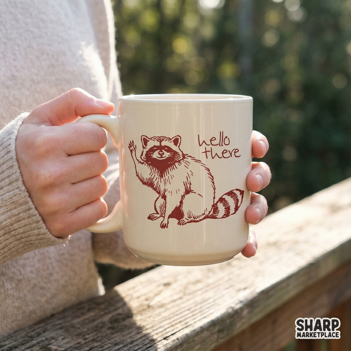Whimsical raccoon design with handwritten hello there text, created in a vintage ink style for stickers, tumblers, and nature-inspired projects.