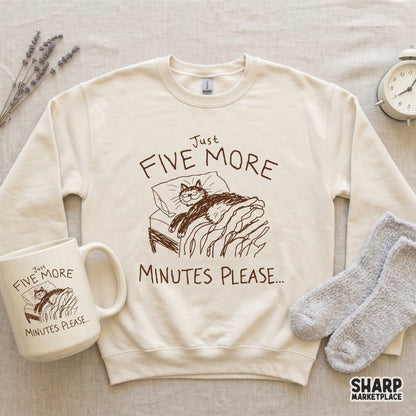 Digital illustration of a cozy cat in bed with whimsical hand-lettered text, suitable for funny t-shirt designs, stickers, or printable home decor.