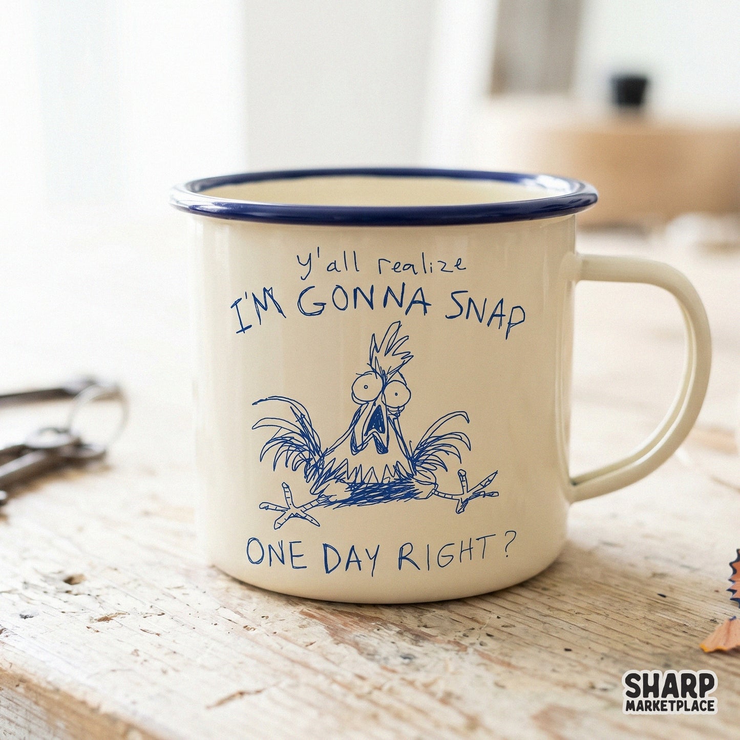 A blue ink sketch of a stressed chicken with the sarcastic quote Y'all Realize I'm Gonna Snap One Day Right? printed on a cream-colored enamel mug.