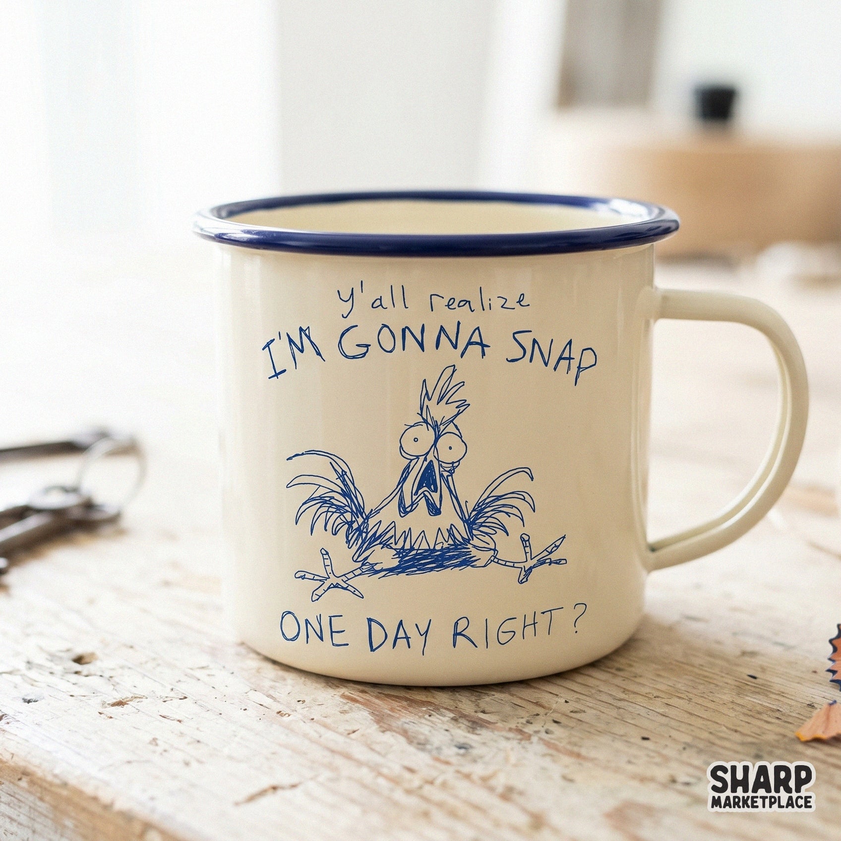 A blue ink sketch of a stressed chicken with the sarcastic quote Y'all Realize I'm Gonna Snap One Day Right? printed on a cream-colored enamel mug.