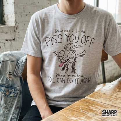 A sarcastic goat illustration on a heather grey t-shirt, featuring a chaotic hand-drawn farm animal and the text Whatever I do to piss you off so I can do it