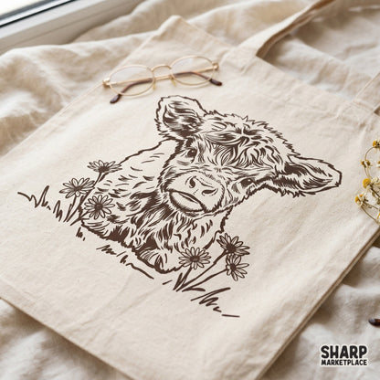 Vintage-style monochromatic sketch of a baby cow with fluffy fur and wildflowers, ideal for creating trendy western shirts and stickers.
