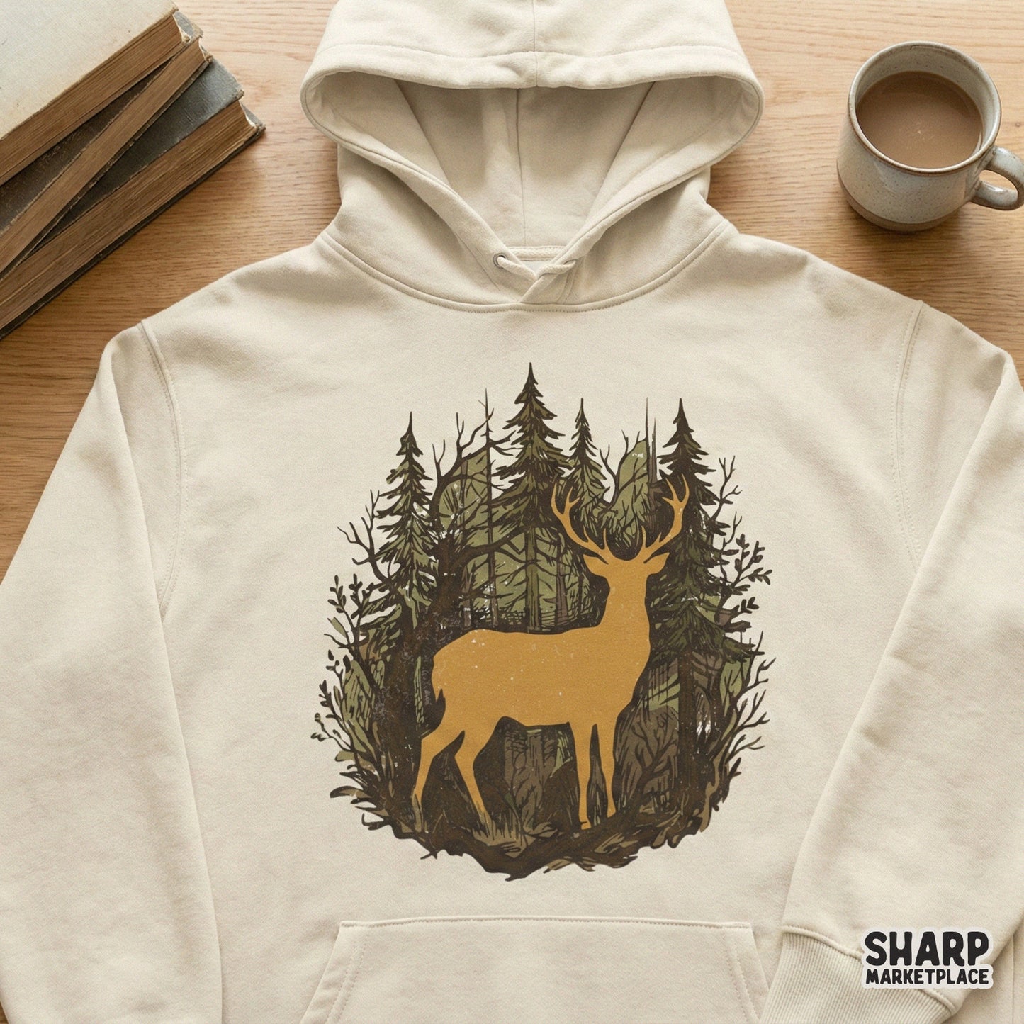 Vintage-style deer forest graphic printed on a cream-colored hoodie, featuring a majestic stag silhouette amidst hand-drawn pine trees and branches.