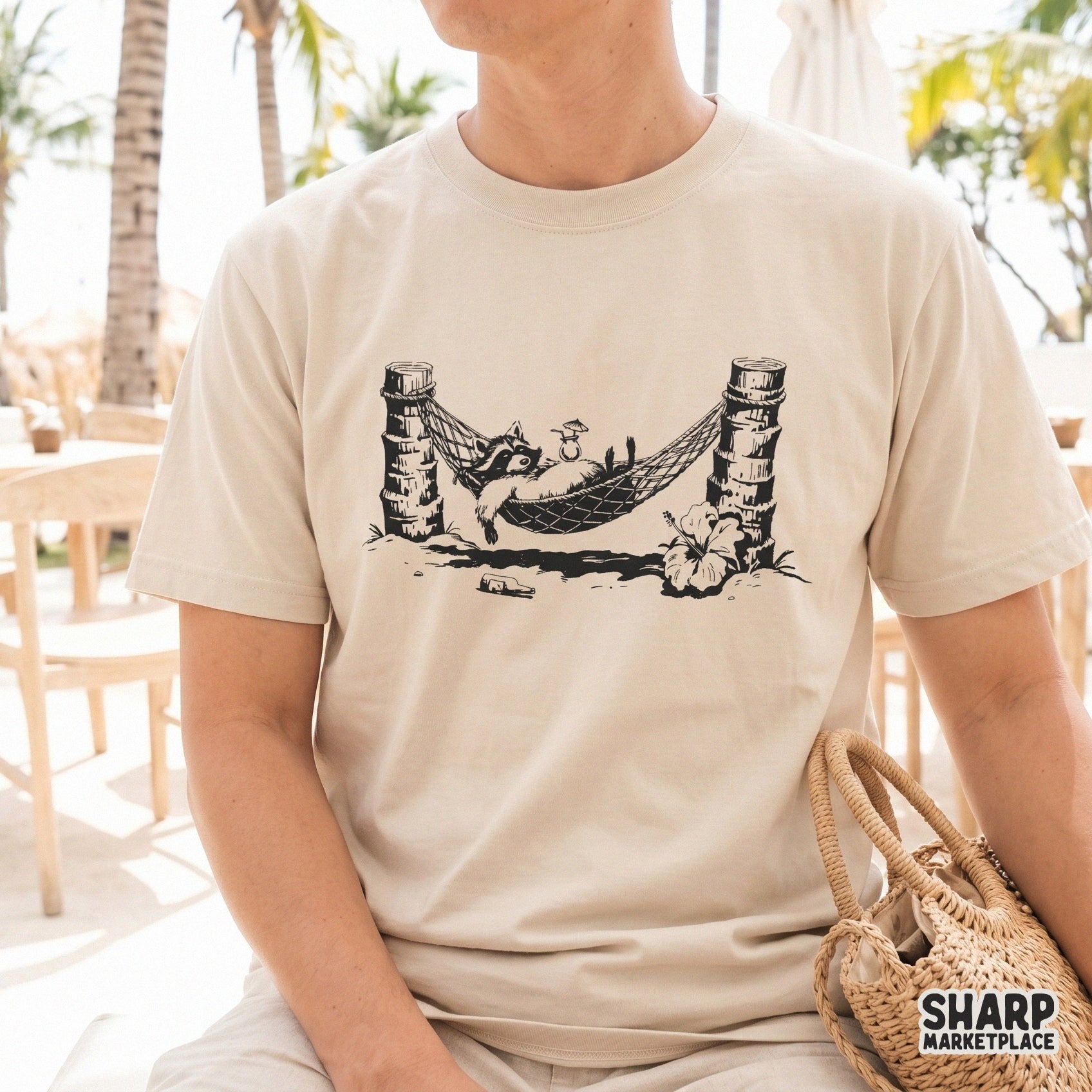 Cute sleeping raccoon in a tropical hammock for a summer beach shirt design