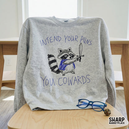 Digital design file featuring a funny, messy sketch of a raccoon knight brandishing a sword with the sarcastic quote Intend Your Puns You Cowards.