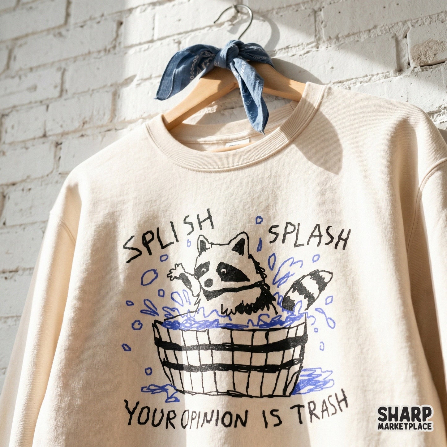 Funny raccoon graphic for apparel or stickers, showing a raccoon bathing in a wooden tub with blue bubbles and the text Splish Splash Your Opinion Is Trash.