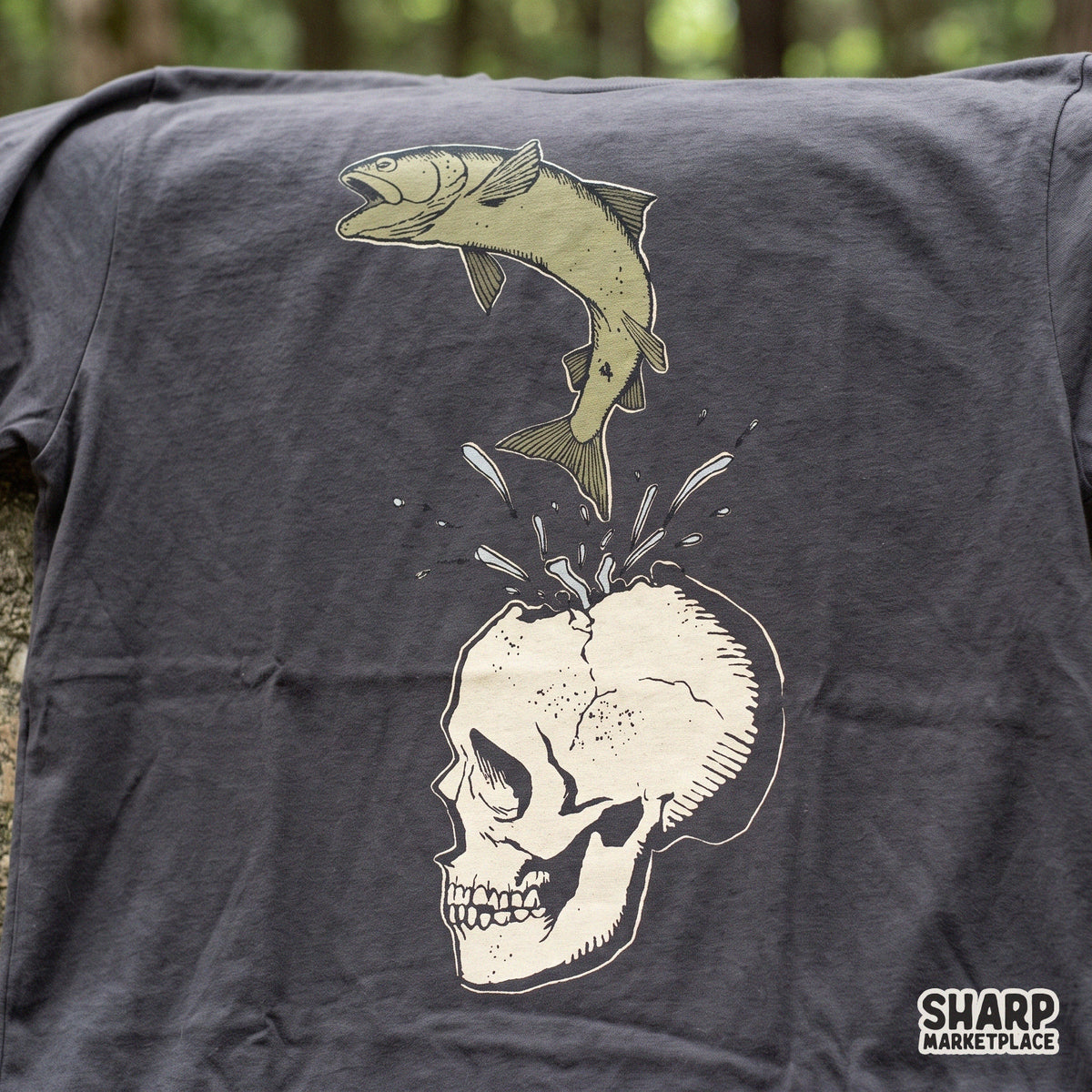 Surreal fish jumping out of a cracked skull weirdcore art PNG design for t-shirt sublimation and apparel