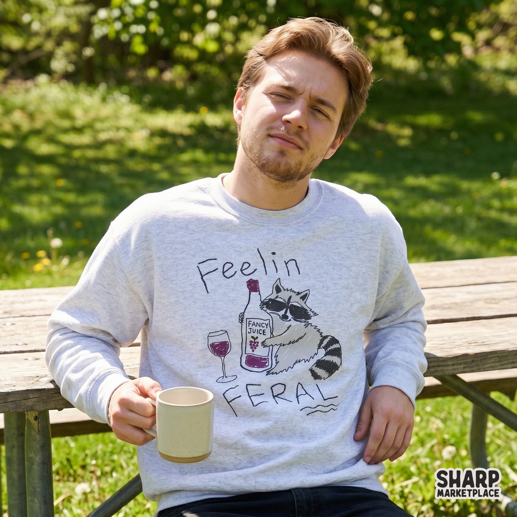 Funny raccoon sublimation design featuring a trash panda with sunglasses, a bottle of wine, and the sarcastic text Feelin Feral for apparel or tumblers.