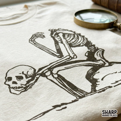 High-resolution black and white skeletal illustration for DIY projects, featuring a gothic figure in a thoughtful pose for stickers or wall art.